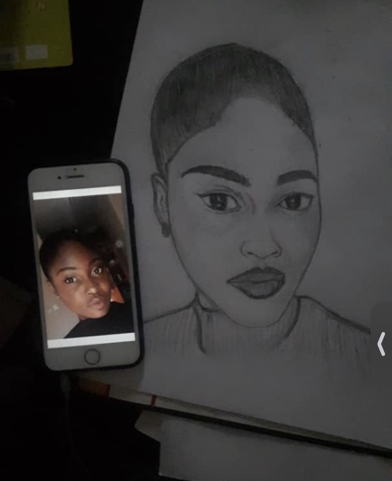 Pencil portrait drawing by Immanuel Obani, working as ROKKU_R, shown alongside the reference photo